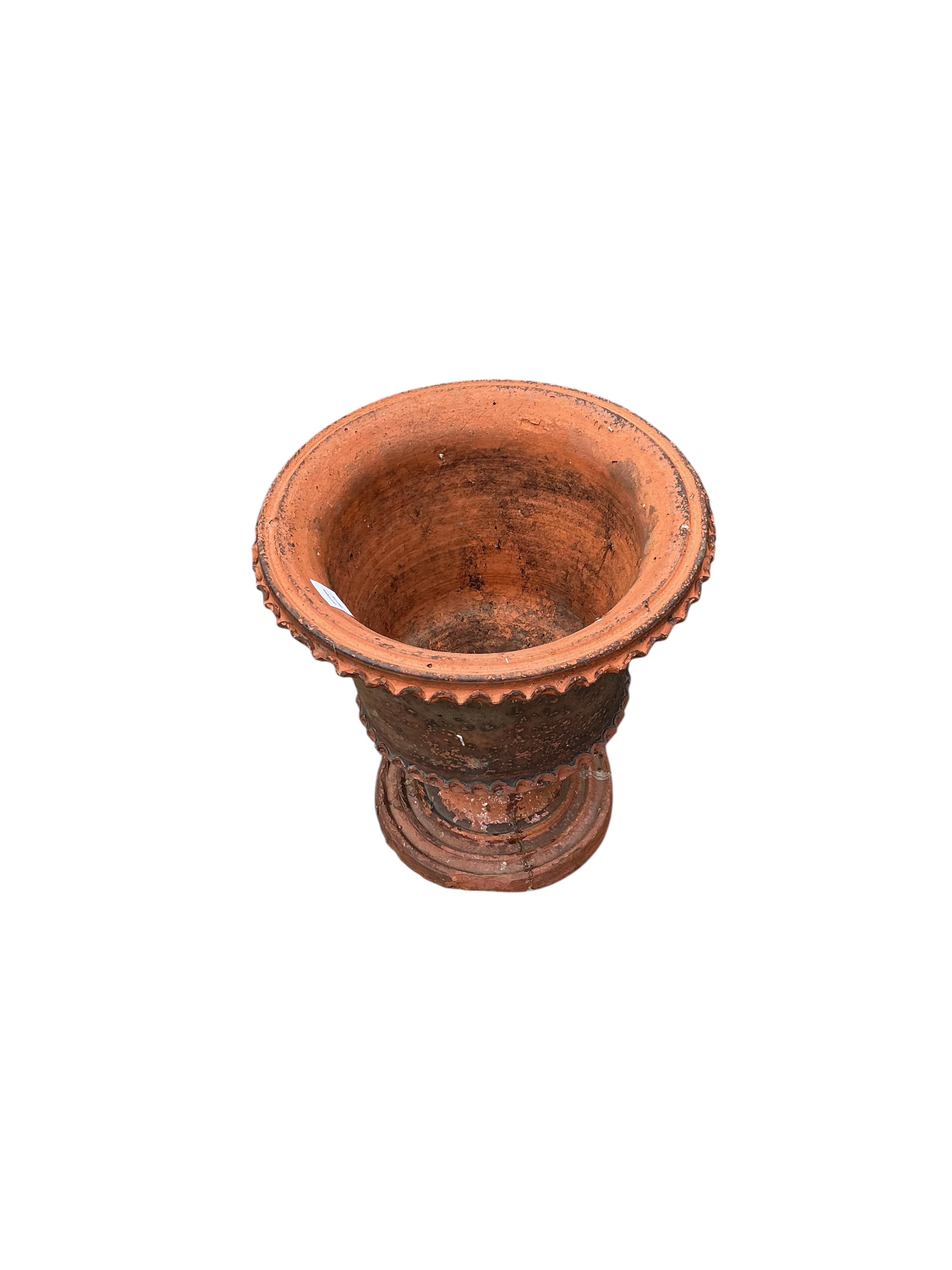 A terracotta urn, diameter 40cm, height 43cm
